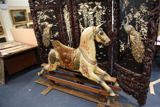 Orton & Spooner. A carved and painted wood carousel horse Jack, H.4ft 5in. Overall L.7ft 4in.